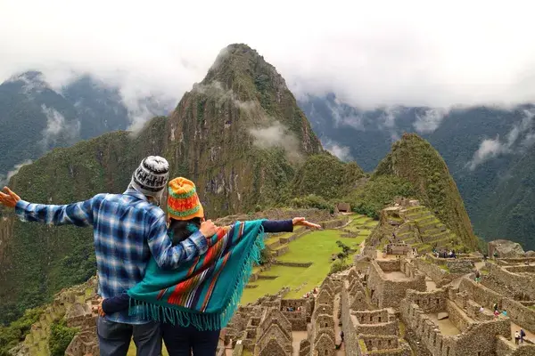 Couple admiring the spectacular view of Machu Picchu Canva Pro