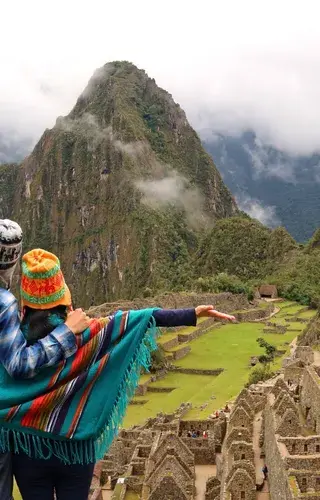 Couple admiring the spectacular view of Machu Picchu Canva Pro