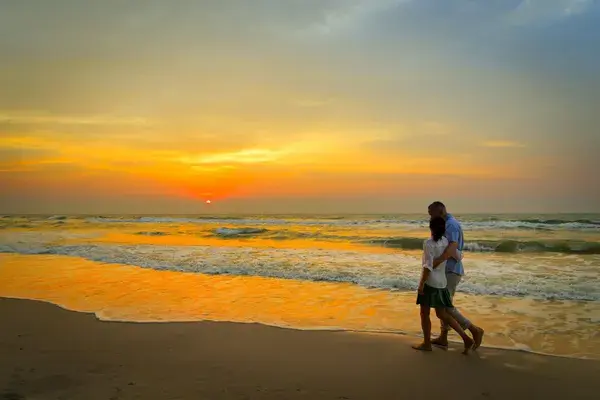 Couple walking on the beach in thailand