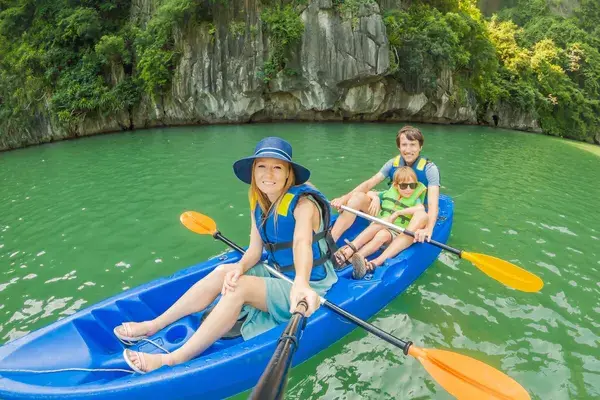 Family canoeing in Ha Long Bay Vietnam