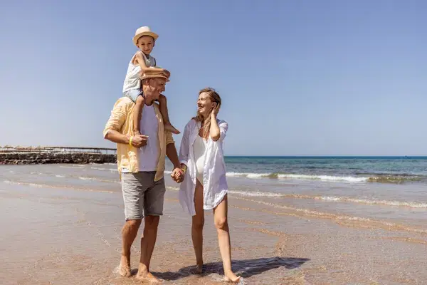 Family walking on beach cambodia canva