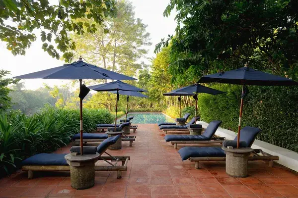 Pool with sunbeds raya heritage chiang mai thailand facebook page